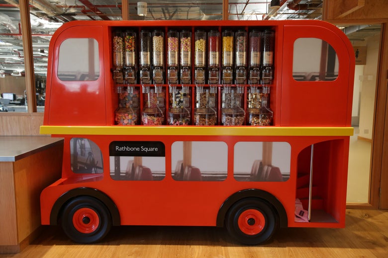 A candy dispenser decorated as a double-decker London bus is displayed at Facebook's new headquarters, designed by Canadian-born American architect Frank Gehry, at Rathbone Place in central London on December 4, 2017.
Social media titan Facebook opened a new office in London on December 4, 2017, that is set to be its biggest engineering hub outside America, the company has announced. / AFP PHOTO / Daniel LEAL-OLIVAS (Photo credit should read DANIEL LEAL-OLIVAS/AFP/Getty Images)